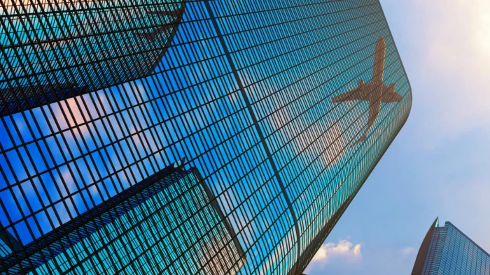 glass-building-aeroplane-shadow-banner